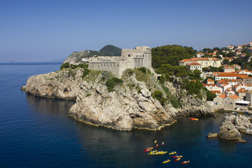 Fototapeta na wymiar Kayaking by Old Fort Lovrijenac, Dubrovnik, Croatia