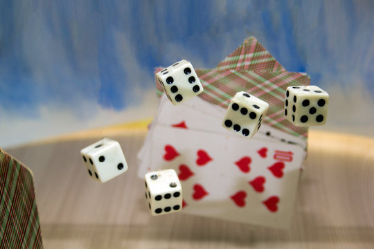 thrown into the air the dice and cards
