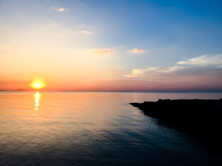 Photo of beautiful sunset on the beach.