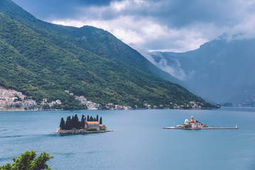 Our Lady Of The Rocks and Saint George islets near Perast on Kotor Bay. Saint George Benedictian monastery and Roman Catholic Church of Our Lady Of the Rocks are situated on the islands.