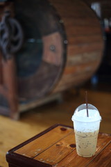 Ice coffee on the wooden table