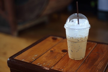 Ice coffee on the wooden table