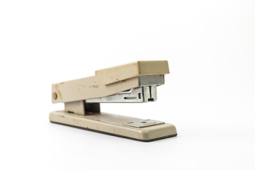 Cream stapler stationery on white background