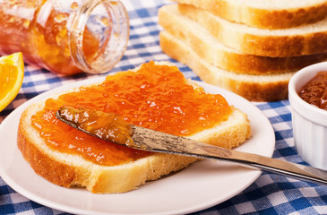 Slices of bread with orange jam