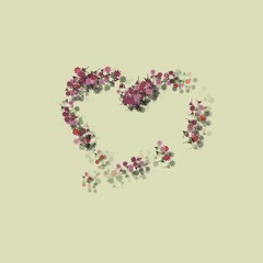 Cute sweet heart composed of small red orange and pink flowers