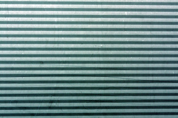 Fototapeta premium Cyan toned Corrugated metal plate surface.