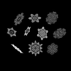 Set of 3d shiny snowflakes on black background. Vector christmas illustration.