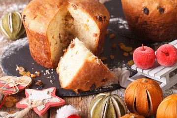 Italian Christmas cake with raisins and festive decoration close-up. horizontal