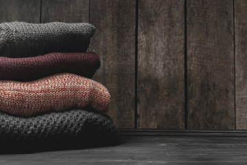 Stack of cozy knitted sweaters