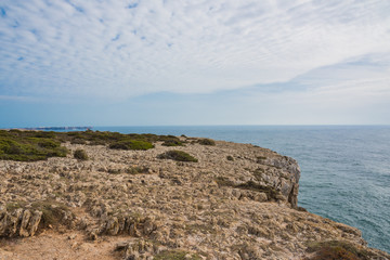 Fototapeta na wymiar Portugal ,Sagres の断崖絶壁　/ Portugal ,Sagres の岬の最先端、岩だらけの断崖絶壁。