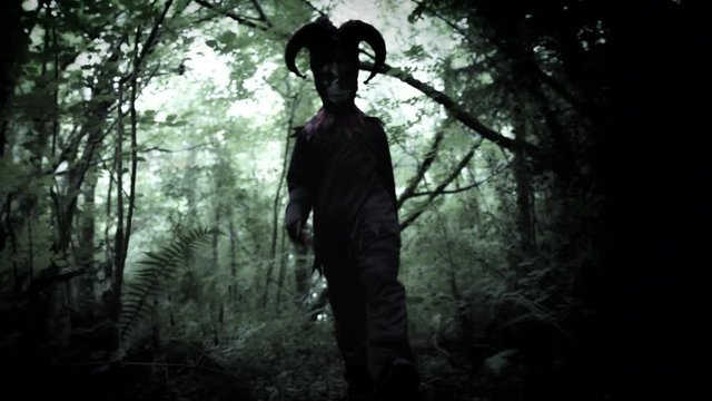4k Halloween Shot of a Child in Joker Costume Moving to Camera