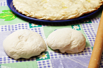 Two pieces of dough and pie