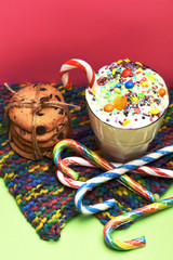 Milk shake with colorful candies and cookies