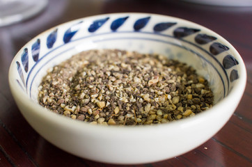 Dry milled pepper in the little bowl