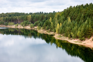 calm lake with reflections of clouds  in summer