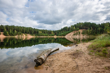 calm lake with reflections of clouds  in summer