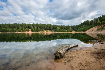 calm lake with reflections of clouds  in summer