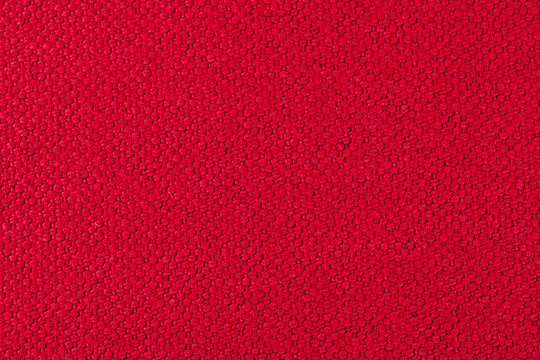Red background  of fabric, one color,  texture of the material