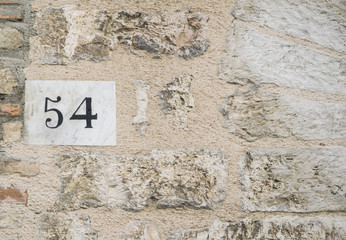 House number 54 sign.