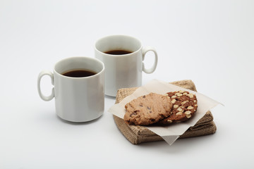 The chocolate cookies and coffee cup set for relax and break from meeting
