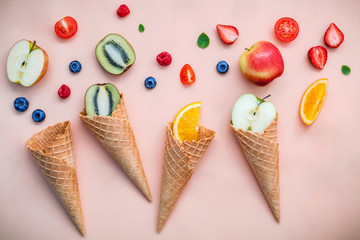 Cones and colorful various fruits raspberry ,blueberry ,strawber