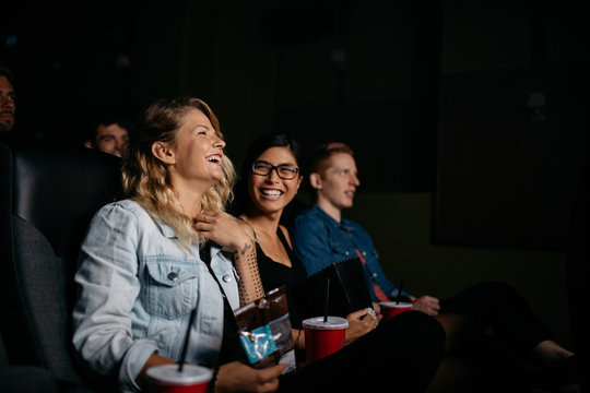 Group of young people watching movie