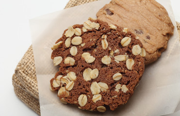 The chocolate cookies on sack set for relax and break from meeting. Close up Concept