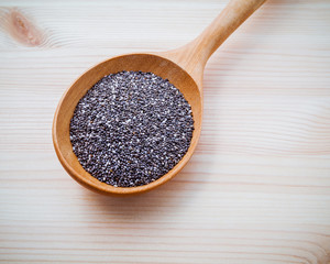 Nutritious chia seeds  in wooden spoon for diet foods ingredient
