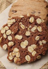 The chocolate cookies on sack set for relax and break from meeting. Close up Concept