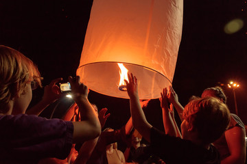 Tourists were interested Yi Peng lantern at Loy Kratong Festival