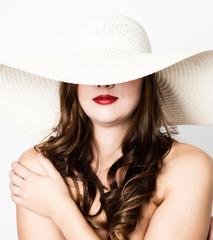 beautiful girl in broad-brimmed hat posing and expresses different emotions. headache, sadness, fatigue