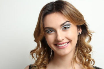 Naklejka premium Portrait of a beautiful girl on a white background 