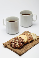 The chocolate cookies and coffee cup set for relax and break from meeting