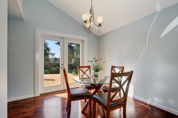 Pastel blue walls and vaulted ceiling of American dining room