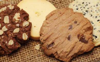 The chocolate cookies on sack set for relax and break from meeting. Close up Concept