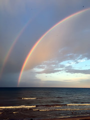 Colorful rainbow over Black Sea beach