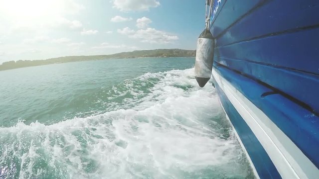 Passenger sailboat sailing on sea, slow motion