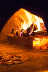 Foto op Canvas The inside of a pizza oven with fire © fotografiecor