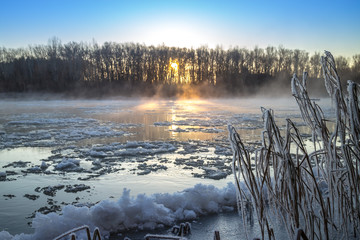 Sunrise during freeze-up in the river - Powered by Adobe