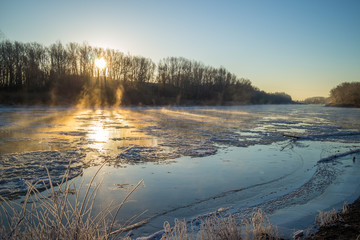 Sunrise during freeze-up in the river