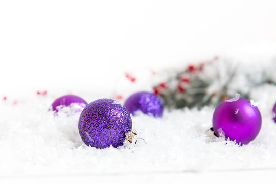 Christmas and New Year decoration. Christmas violet balls on abstract background, soft focus. Coloring and processing photos. Shallow depth of field