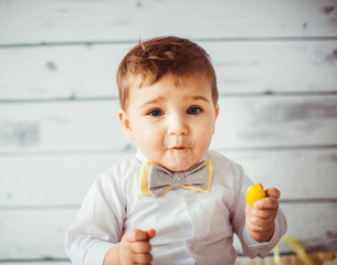 beautiful portrait of cute and little boy with bowtie