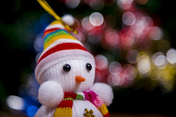 Festive snowman with Christmas light background