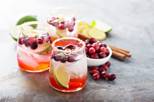 Cold winter cocktail with cranberry and lime