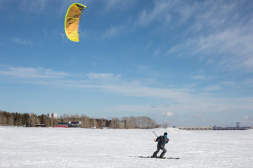riding the kite on the ice of big lake