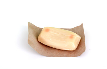 unused soap with cocoa aroma on white bakground