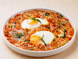 Scrambled eggs with tomatoes and red peppers.