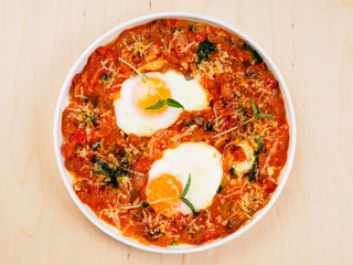 Scrambled eggs with tomatoes and red peppers.