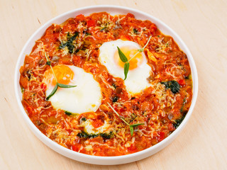Scrambled eggs with tomatoes and red peppers.