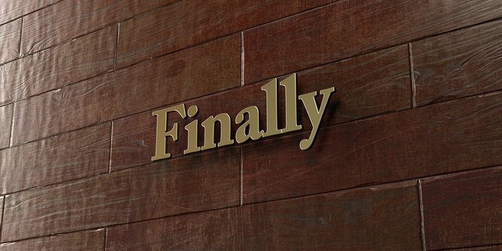 Finally - Bronze plaque mounted on maple wood wall  - 3D rendered royalty free stock picture. This image can be used for an online website banner ad or a print postcard.